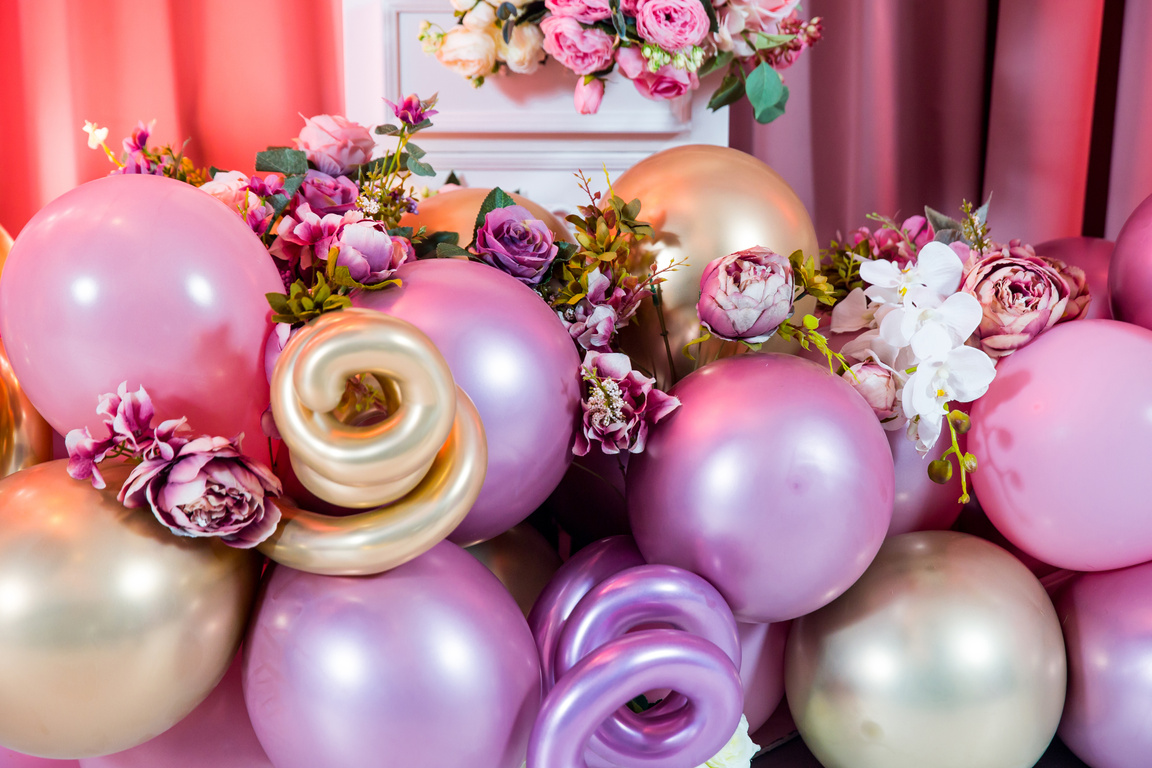 decoration balloons and flowers on pink background